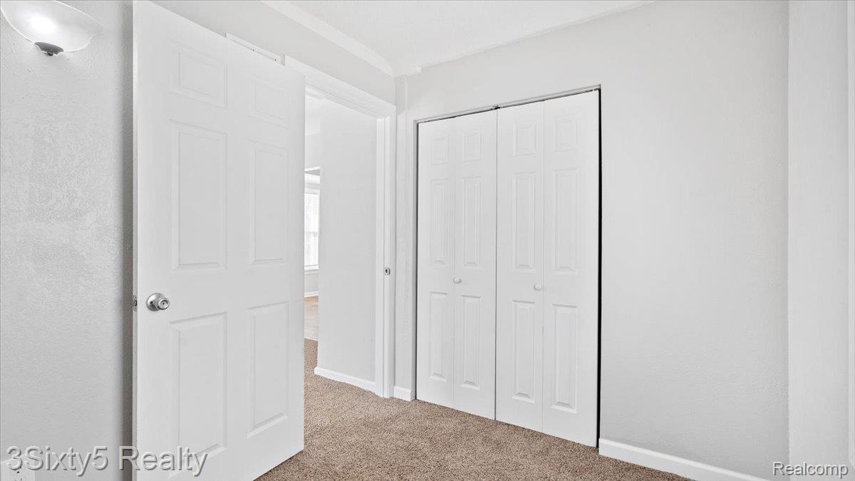202 Haltiner Street River Rouge, MI 48218 - Photo 9 of 19 Unfurnished bedroom with light carpet and a closet