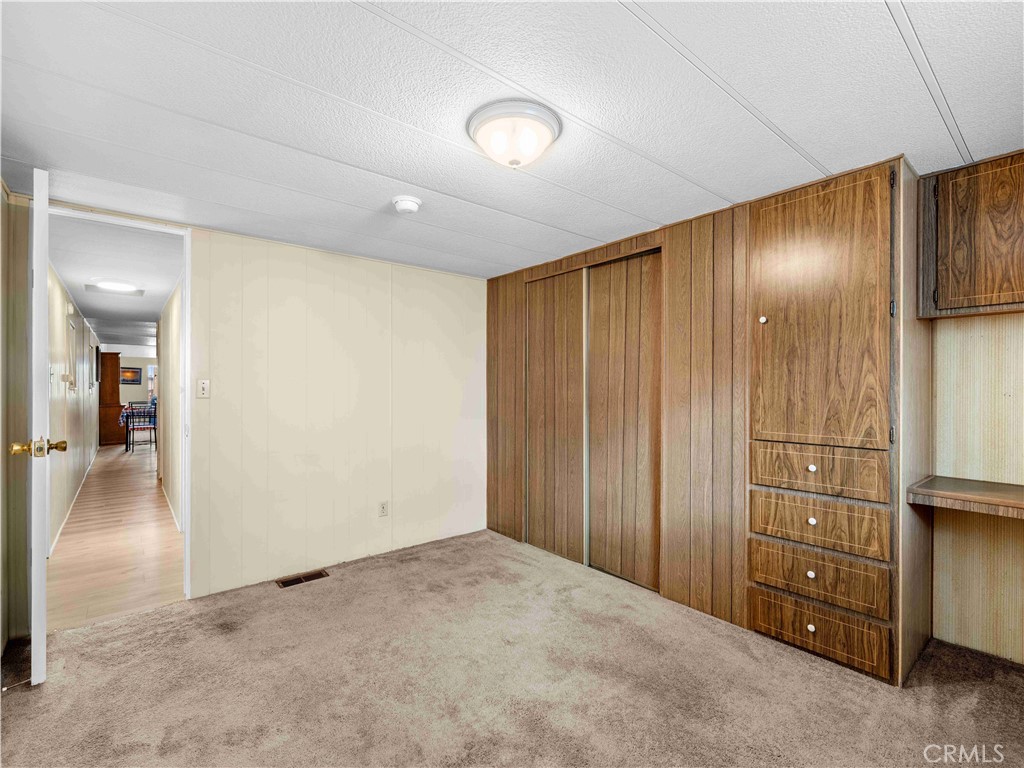 11414 Serra Road, Unit 46 Apple Valley, CA 92308 - Photo 15 of 22 wooden floor in an empty room