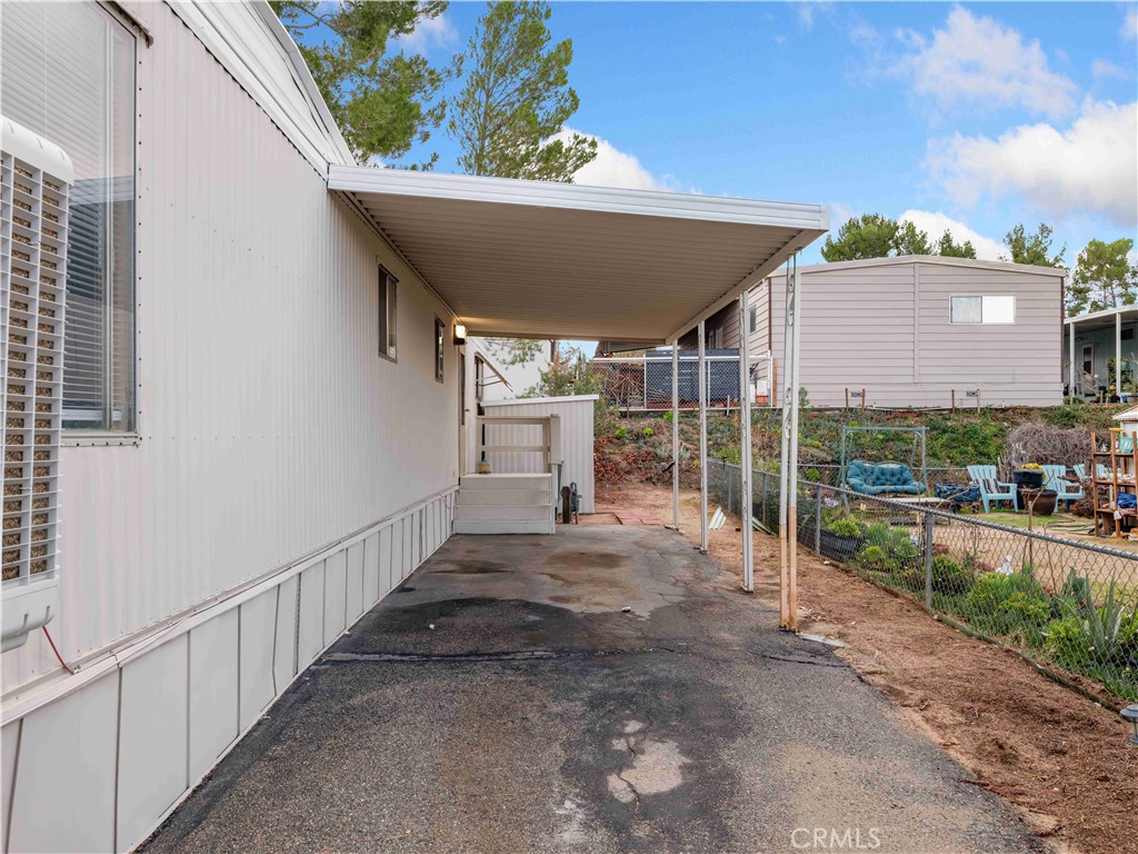 11414 Serra Road, Unit 46 Apple Valley, CA 92308 - Photo 17 of 22 a view of a patio with table and chairs