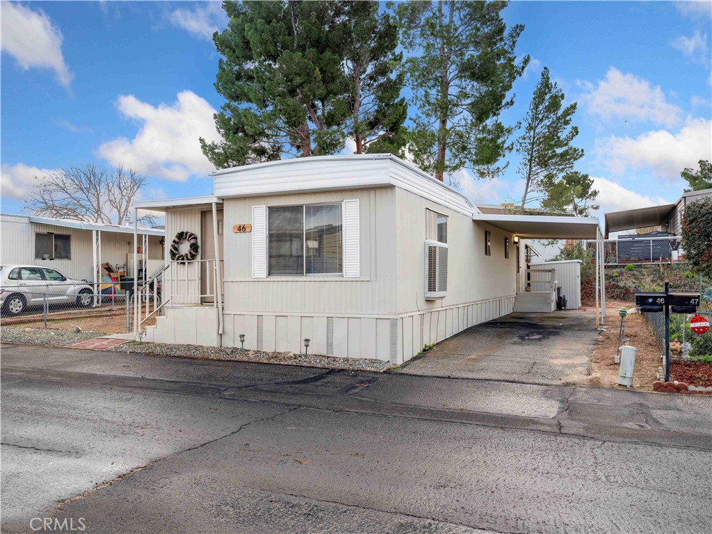 11414 Serra Road, Unit 46 Apple Valley, CA 92308 - Photo 2 of 22 a view of a white house