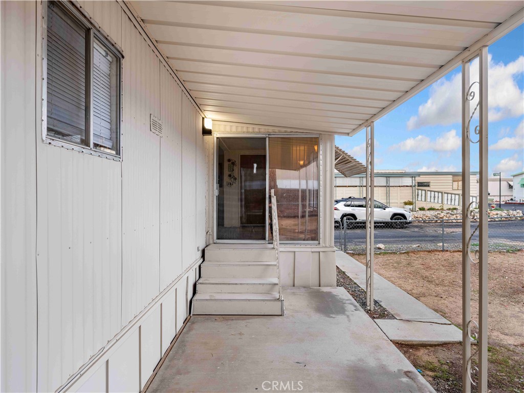 11414 Serra Road, Unit 46 Apple Valley, CA 92308 - Photo 21 of 22 a view of a porch