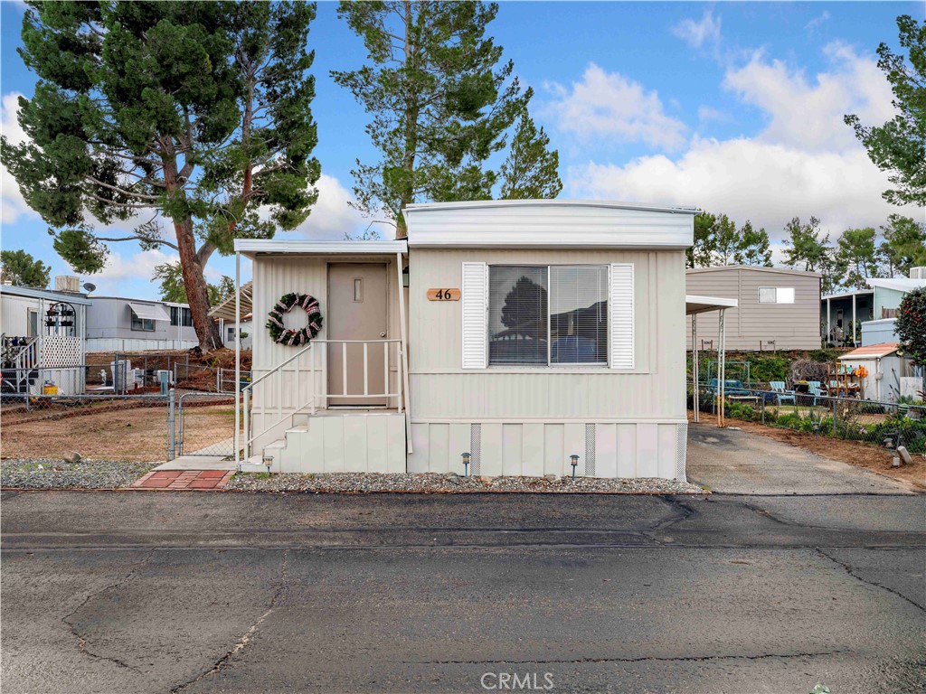 11414 Serra Road, Unit 46 Apple Valley, CA 92308 - Photo 22 of 22 a house view with a outdoor space
