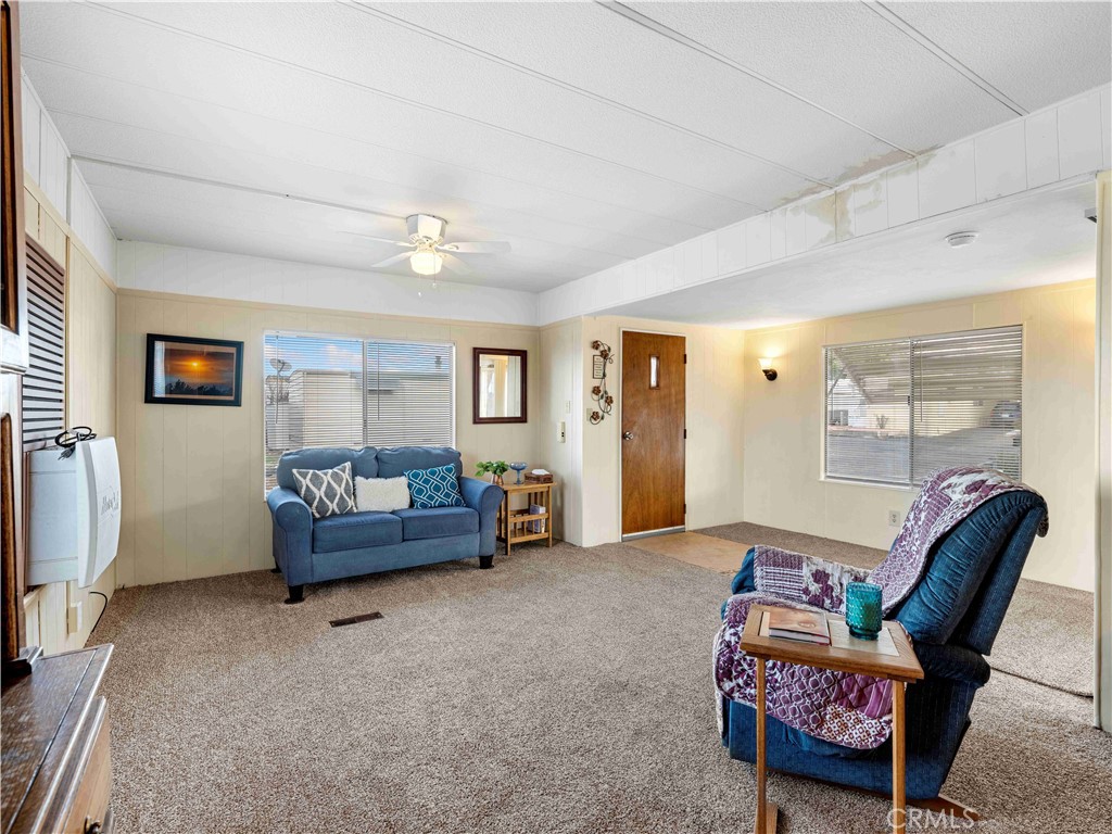 11414 Serra Road, Unit 46 Apple Valley, CA 92308 - Photo 5 of 22 a bedroom with furniture and a window