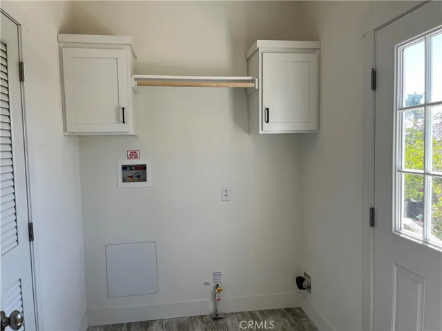 a room with cabinet and a window