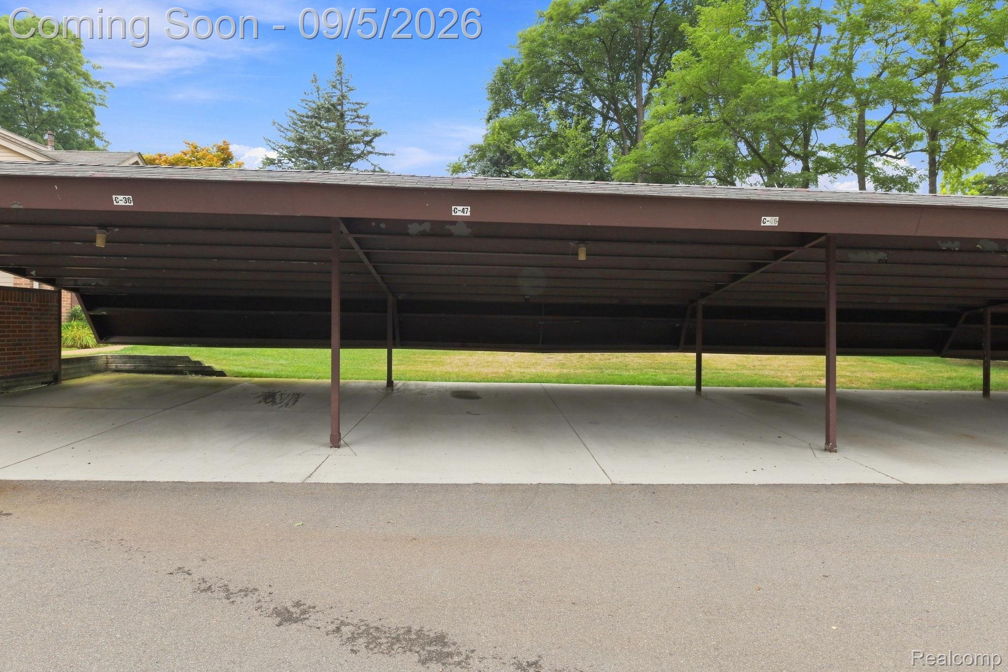 29690 Pine Ridge Circle Farmington, MI 48331 - Photo 27 of 32 Covered parking structure with multiple spaces and a concrete surface