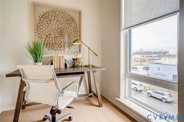 a view of workspace with furniture and a window