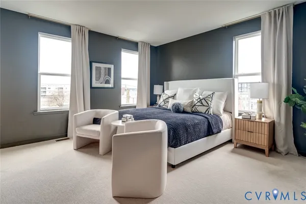 a bedroom with bed and window