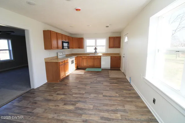 a view of a kitchen from the hallway
