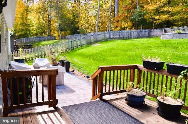 a view of a patio with a table and chairs