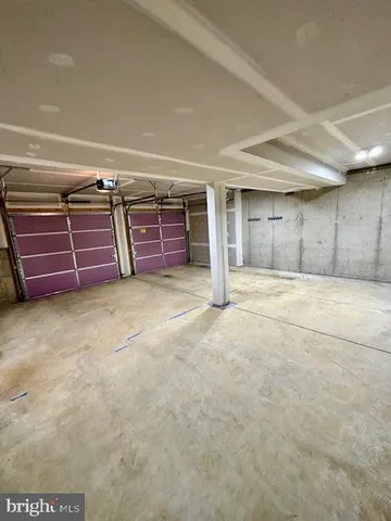 a view of an empty room with furniture