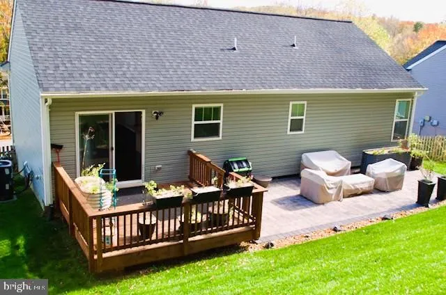a front view of a house with porch and wooden floor