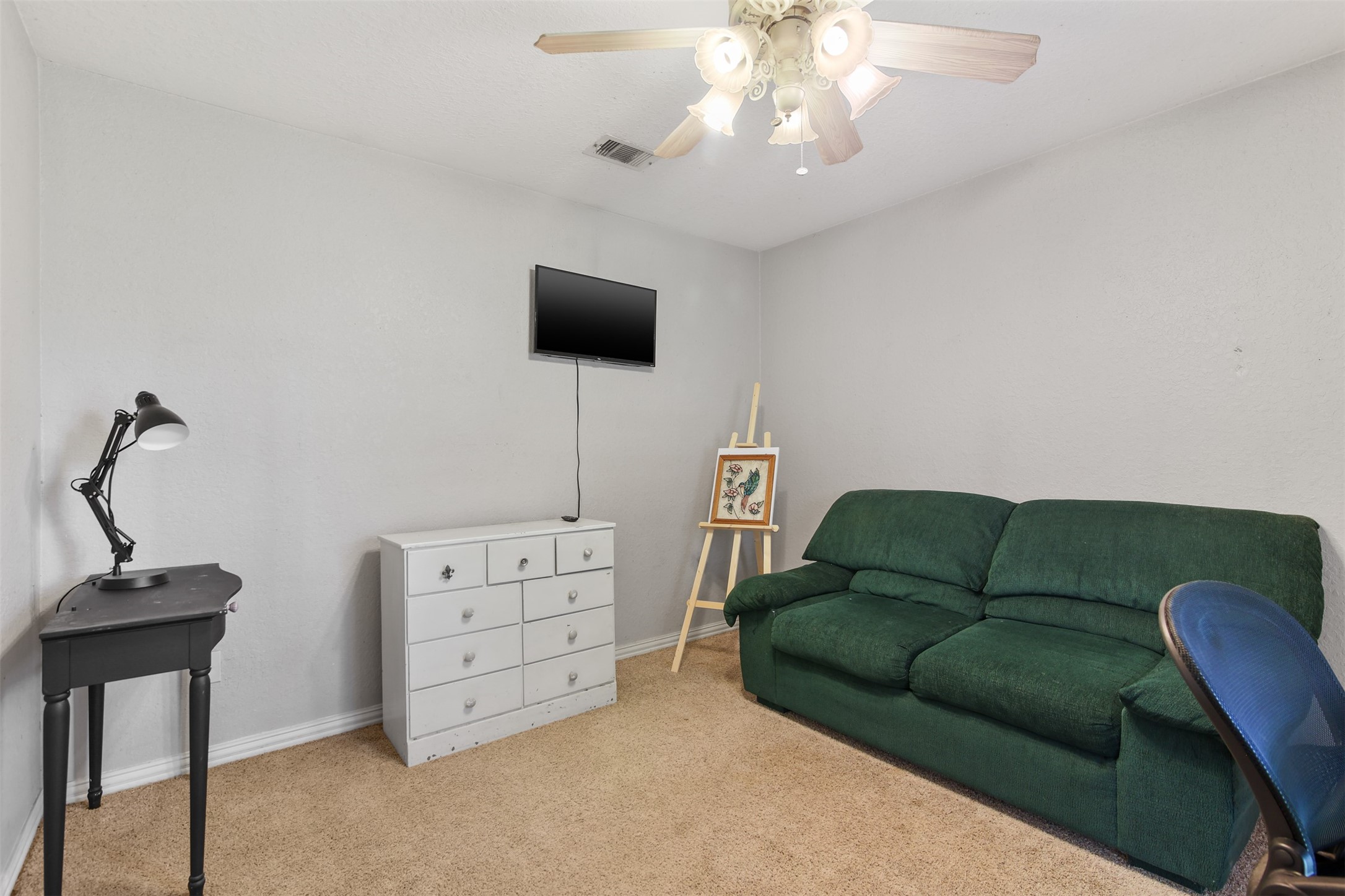 11692 Clark Lane Conroe, TX 77385 - Photo 14 of 35 Secondary bedroom features carpet and ceiling fan.