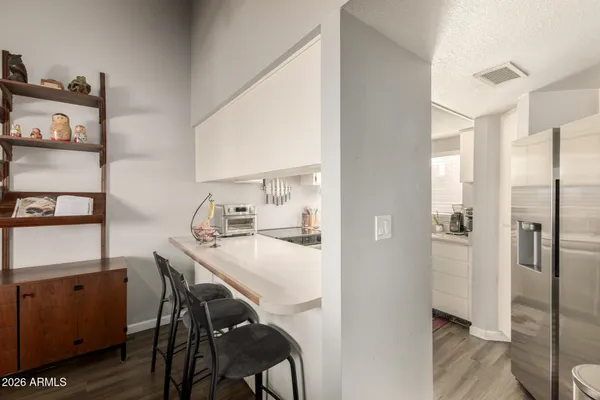 a kitchen with a sink a stove and cabinets