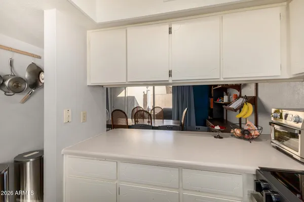 a bedroom with a bed and a lamp