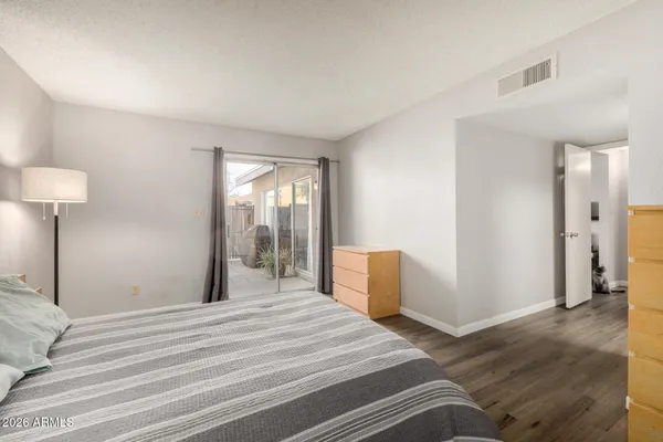 a bedroom with a bed and cabinets