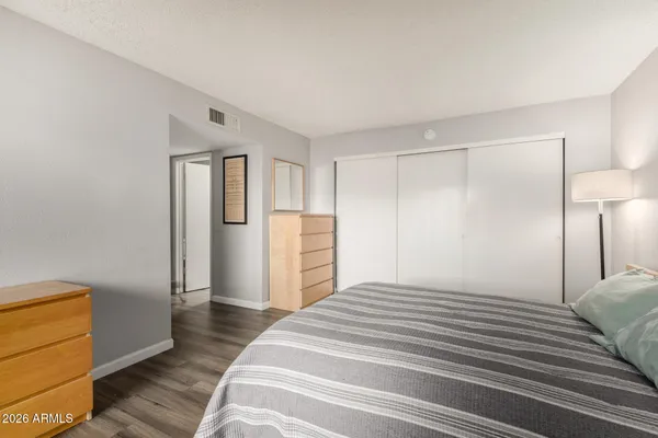 a bathroom with a granite countertop sink a mirror and a