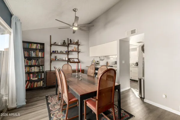 a dining room with furniture window and outside view