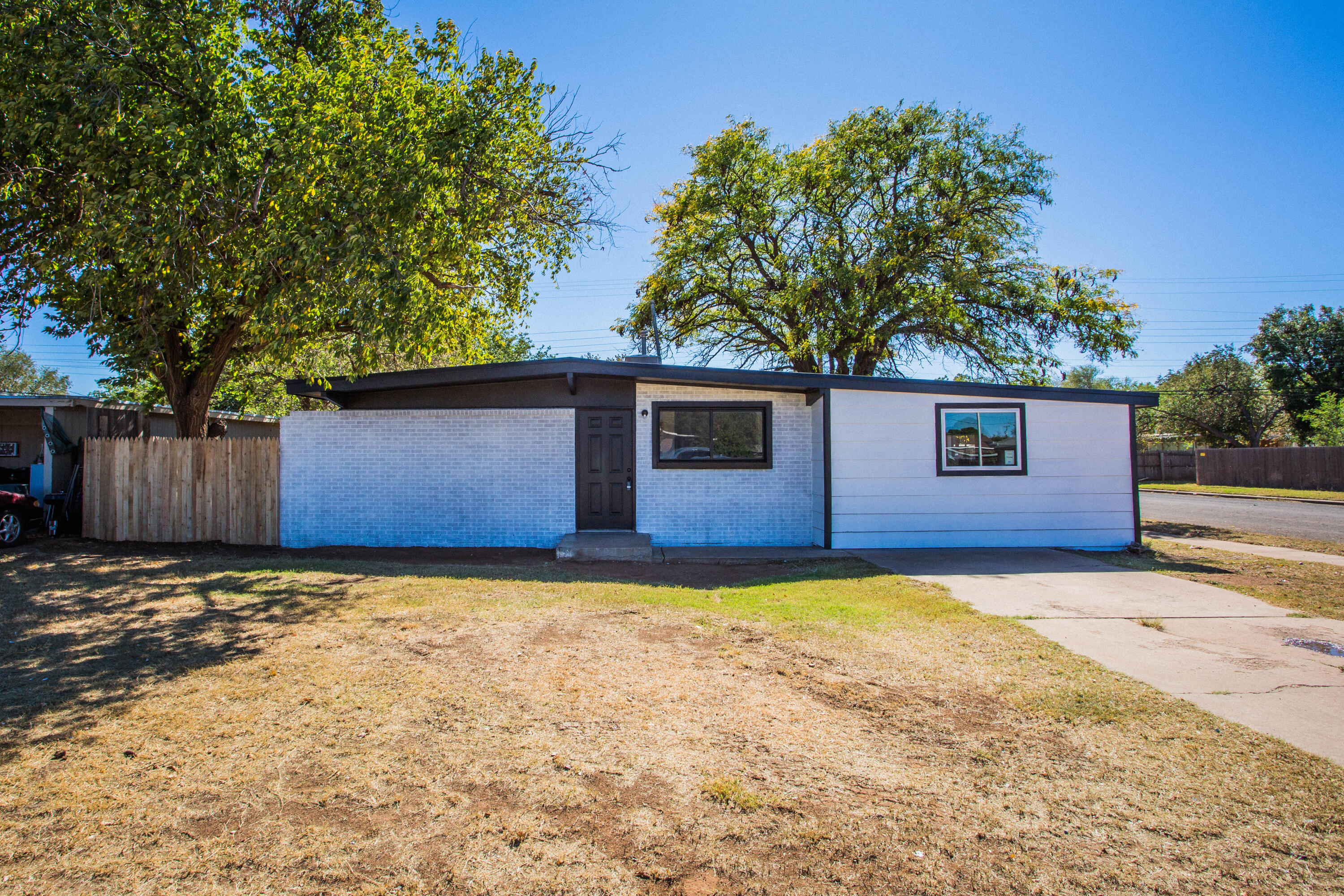 2725 63rd Street Lubbock, TX 79413 - Photo 2 of 42 a view of a house with a yard