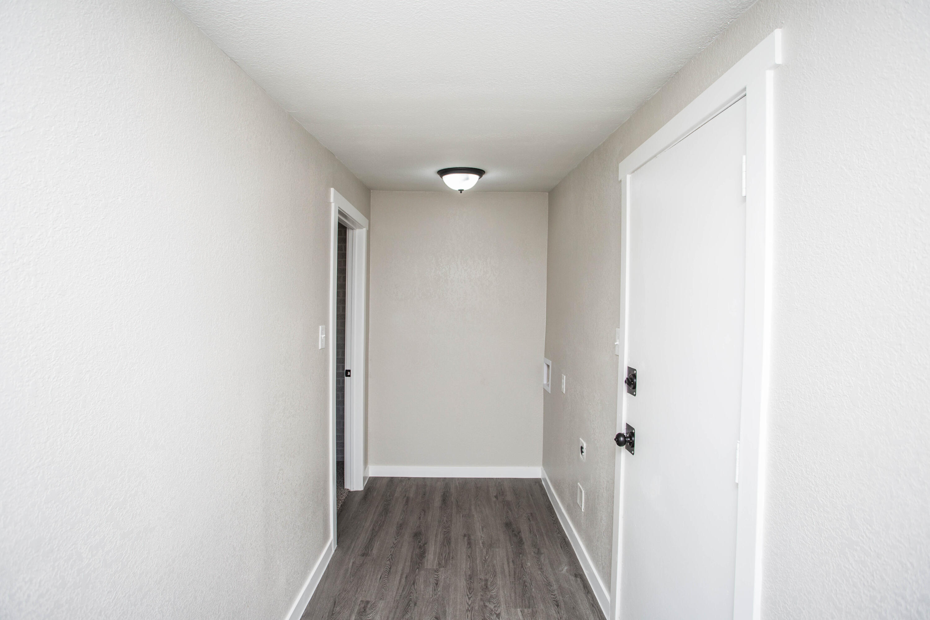 2725 63rd Street Lubbock, TX 79413 - Photo 34 of 42 a view of hallway with wooden floor