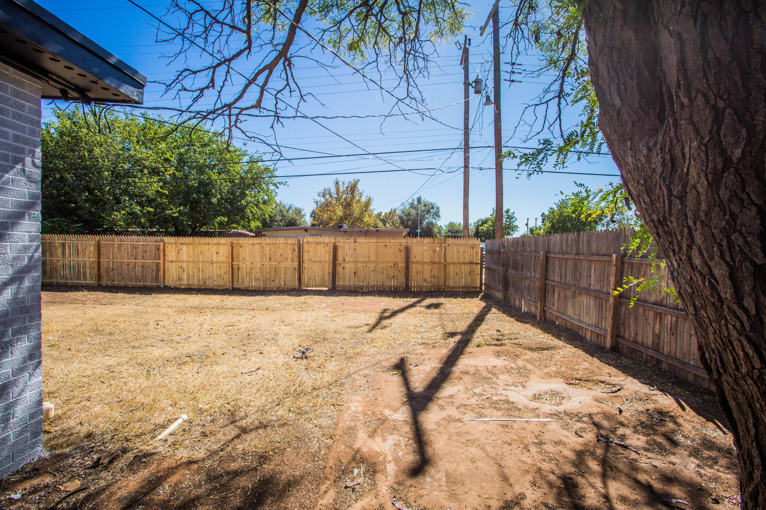 2725 63rd Street Lubbock, TX 79413 - Photo 35 of 42 a view of small yard with wooden fence
