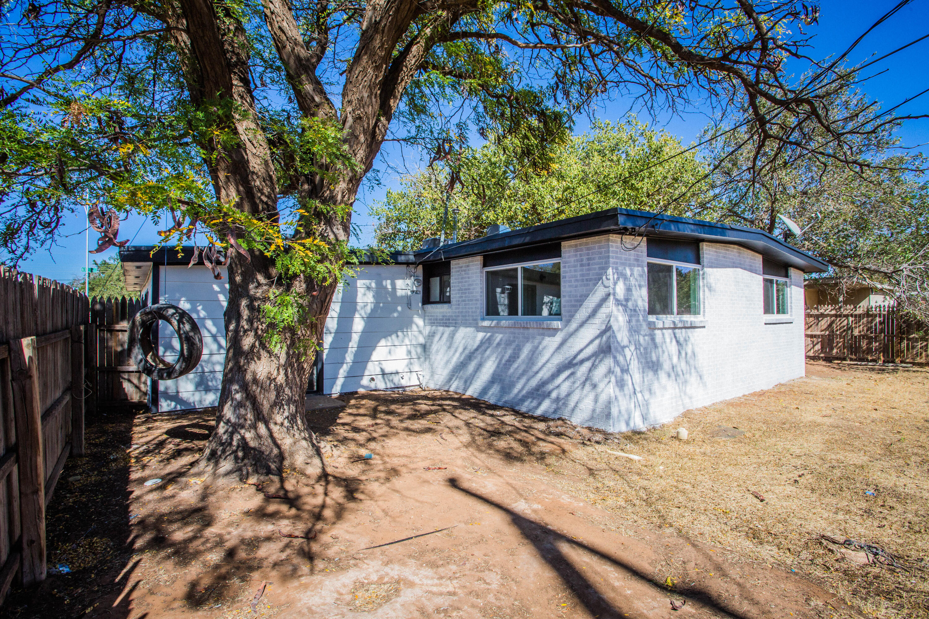 2725 63rd Street Lubbock, TX 79413 - Photo 37 of 42 a view of a house with a yard