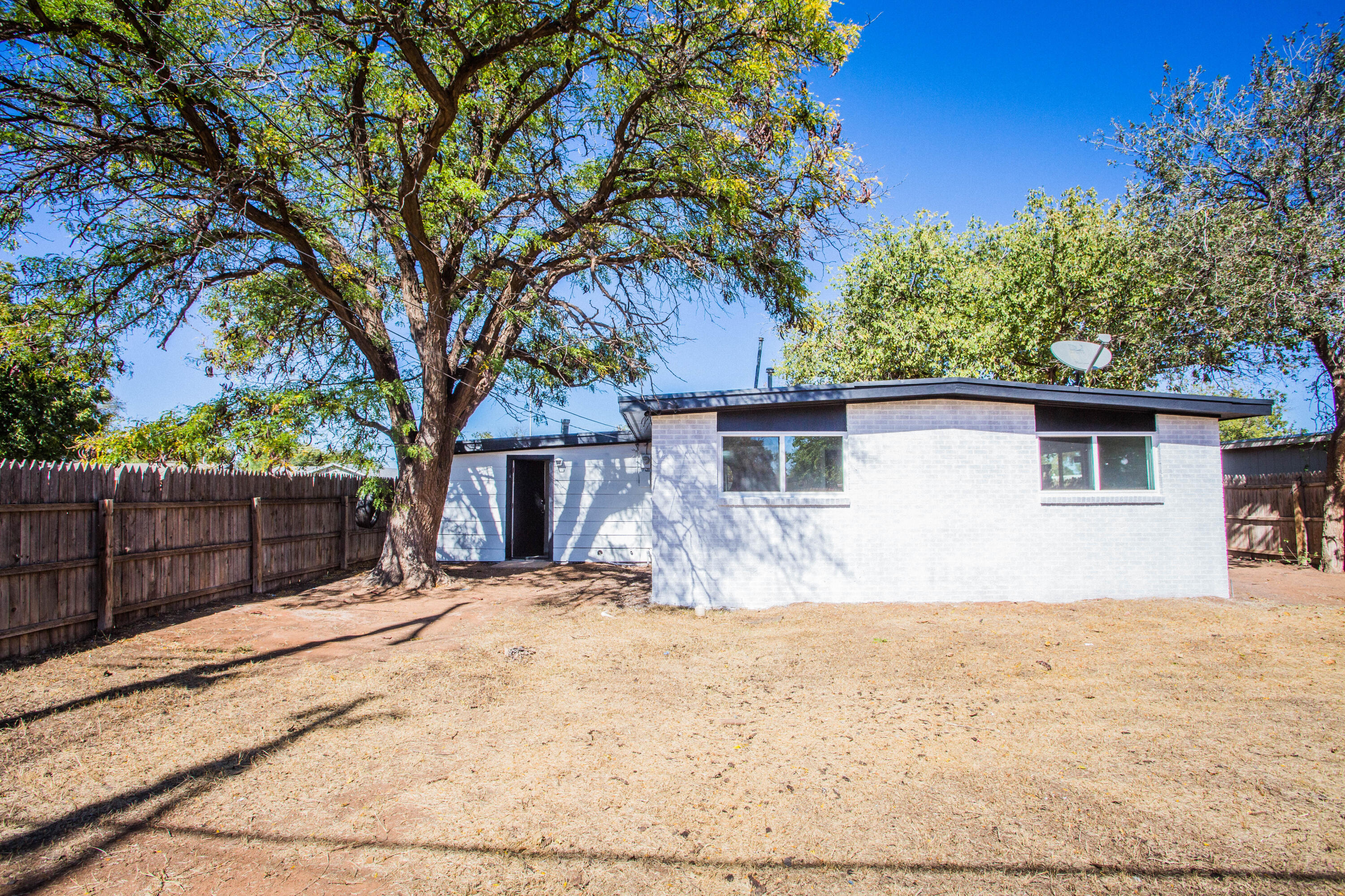 2725 63rd Street Lubbock, TX 79413 - Photo 38 of 42 a view of a house with a tree in the background