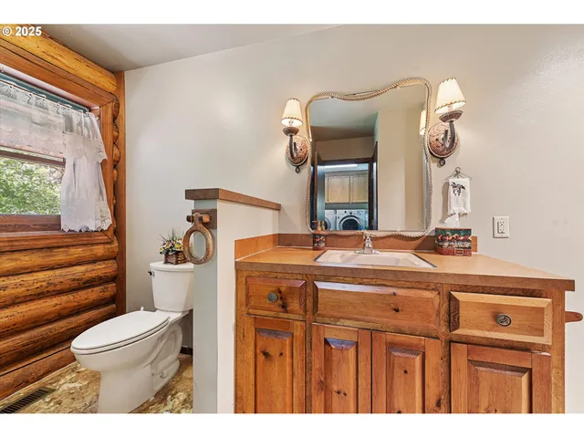 a bedroom with a bed and a view of cabinet