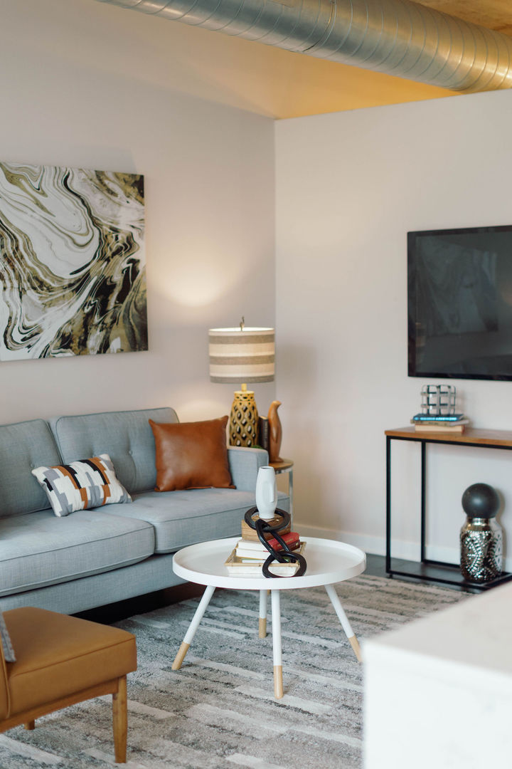 50 East 16th Street, Unit 402 Chicago, IL 60616 - Photo 23 of 33 a living room with furniture and a flat screen tv