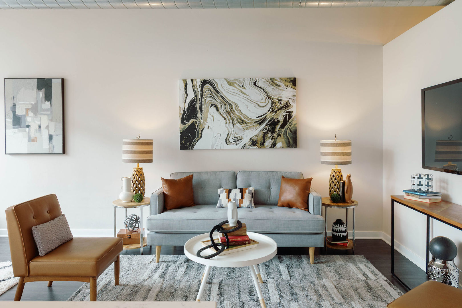 50 East 16th Street, Unit 402 Chicago, IL 60616 - Photo 25 of 33 a living room with furniture and a flat screen tv