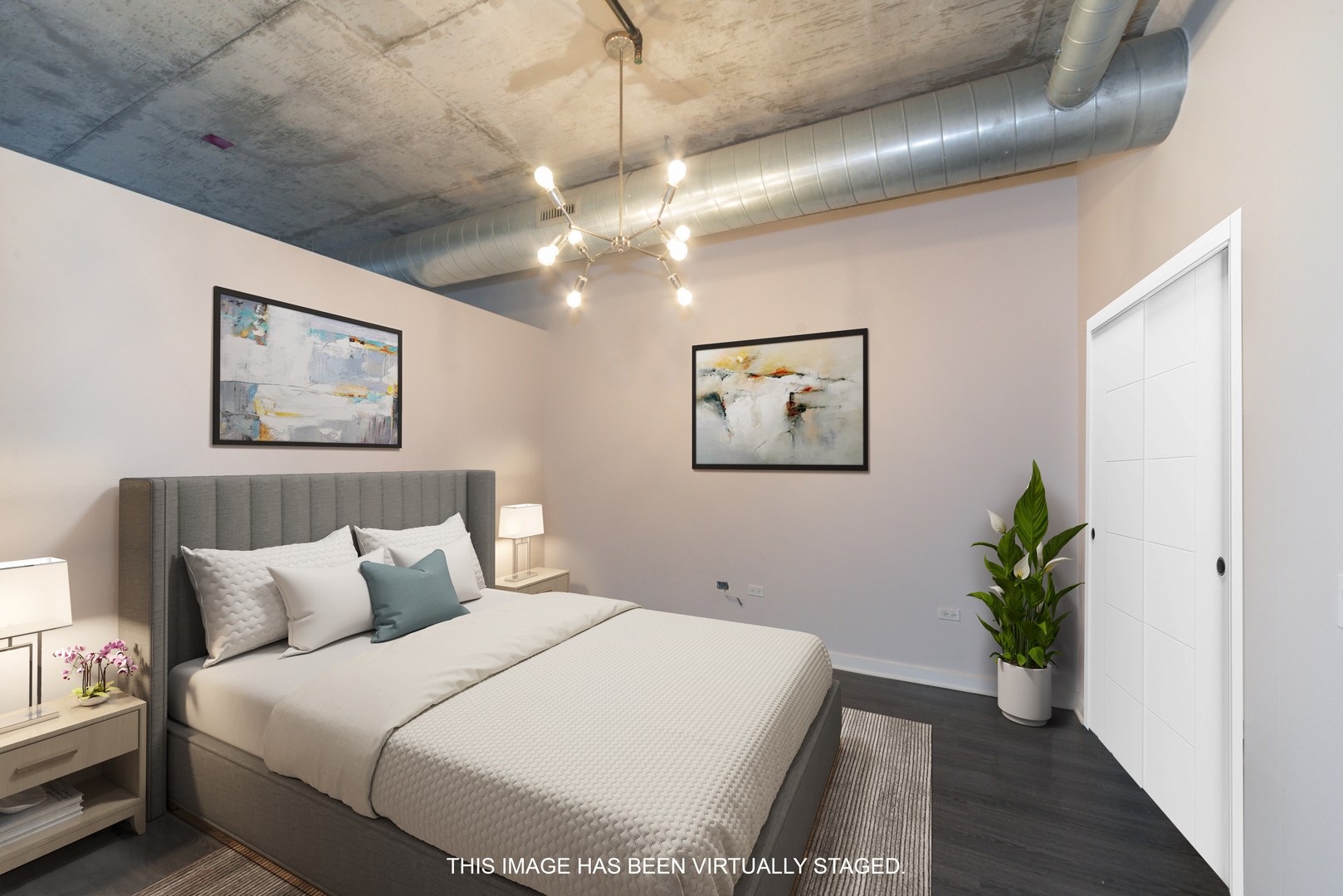 50 East 16th Street, Unit 402 Chicago, IL 60616 - Photo 29 of 33 a bedroom with a large bed and a potted plant