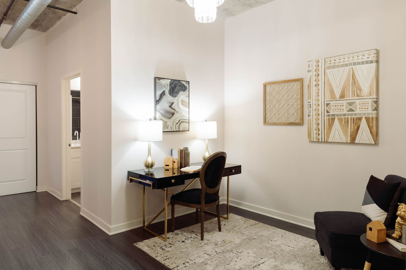 50 East 16th Street, Unit 402 Chicago, IL 60616 - Photo 3 of 33 a view of a workspace with furniture and wooden floor