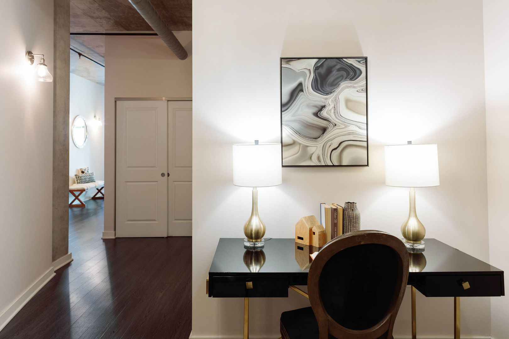 50 East 16th Street, Unit 402 Chicago, IL 60616 - Photo 6 of 33 a workspace with furniture and lamp