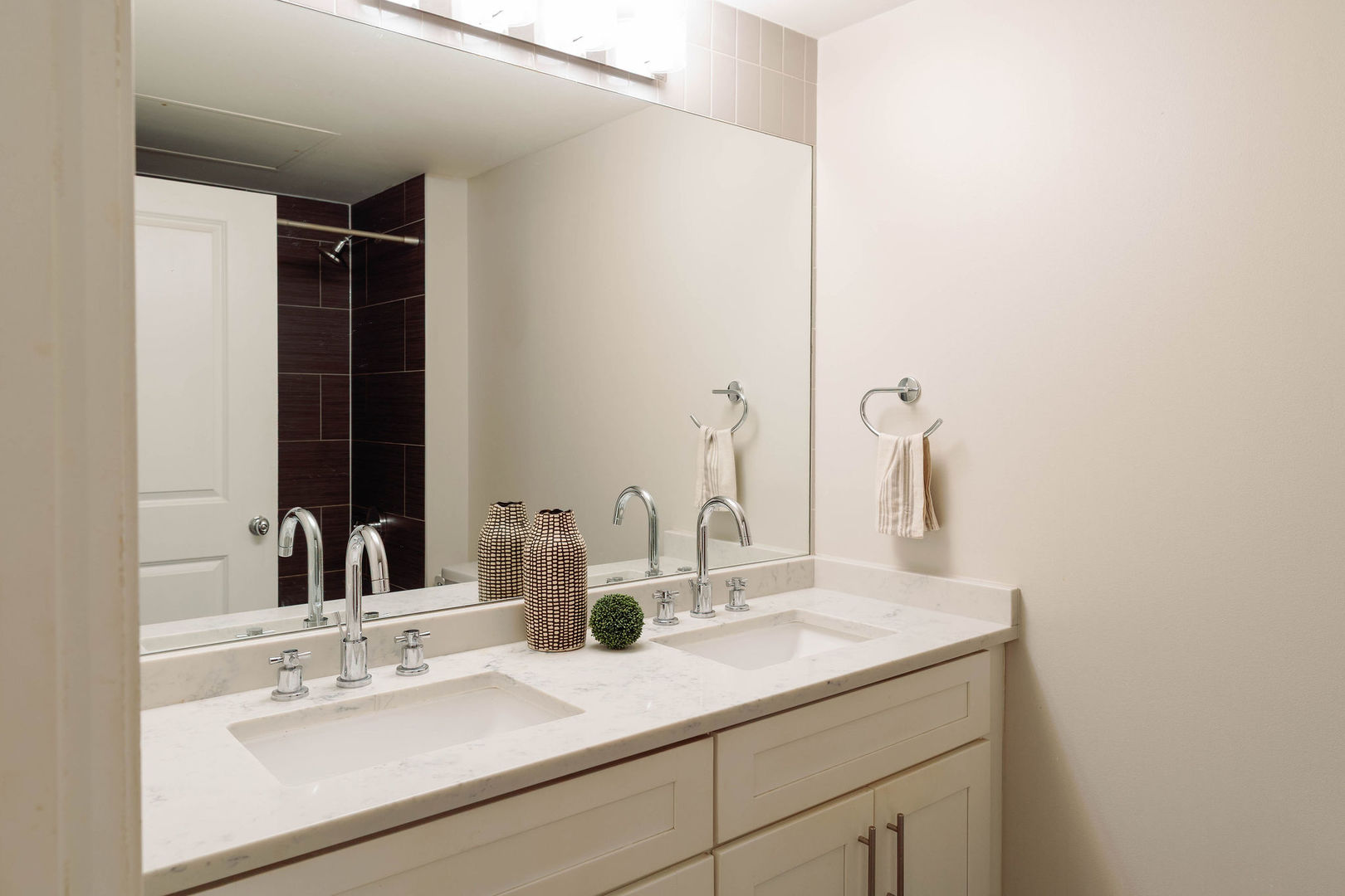 50 East 16th Street, Unit 402 Chicago, IL 60616 - Photo 8 of 33 a bathroom with a sink and a mirror