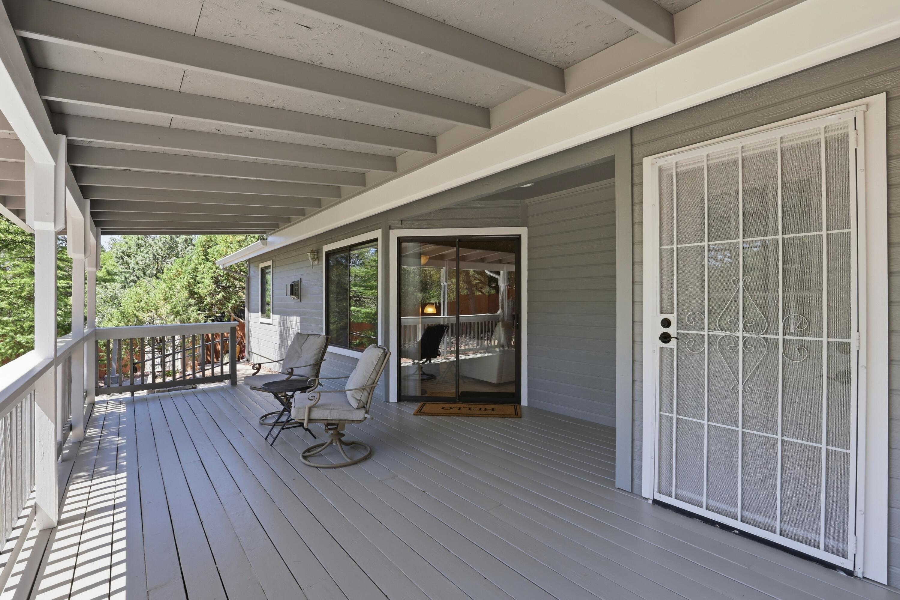 910 West Wagon Trail Payson, AZ 85541 - Photo 2 of 35 a view of a deck with chair and wooden floor