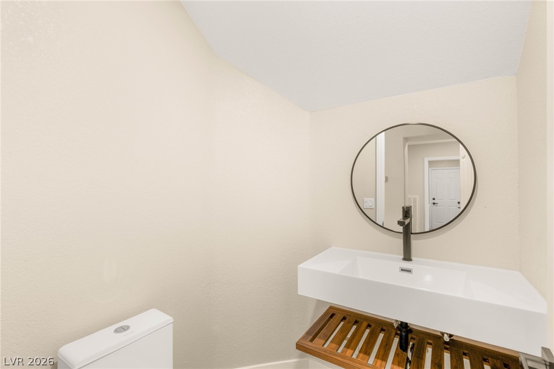 2104 Inverness Drive Henderson, NV 89074 - Photo 20 of 51 Bathroom with toilet and baseboards