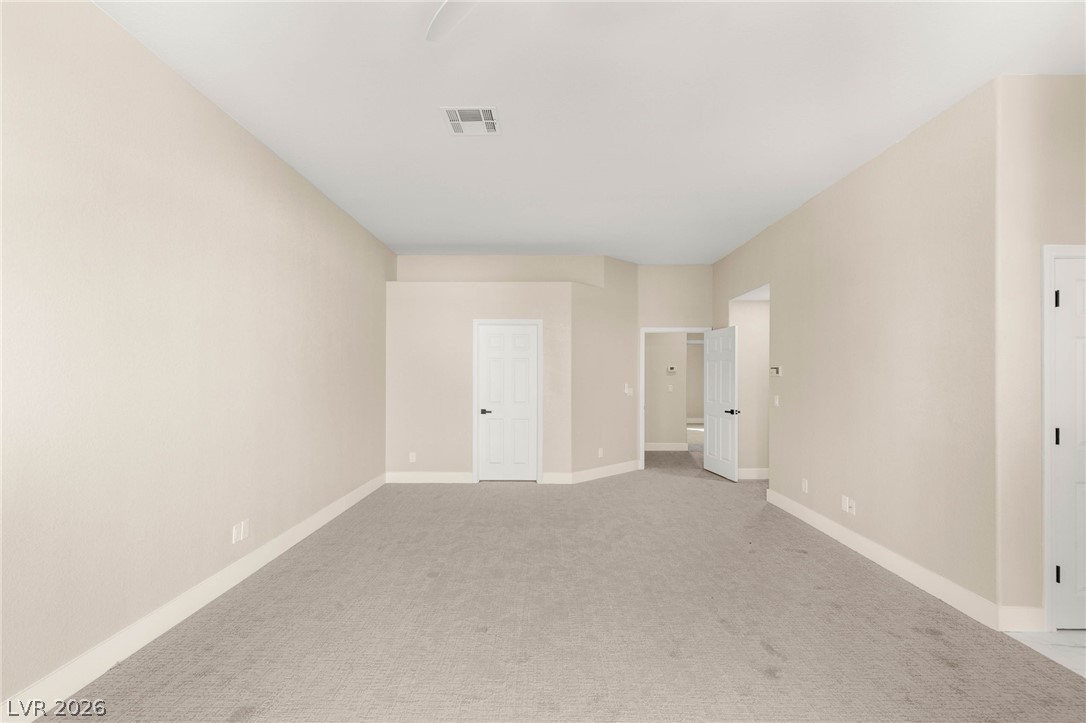 2104 Inverness Drive Henderson, NV 89074 - Photo 26 of 51 Unfurnished bedroom with light carpet and ceiling fan