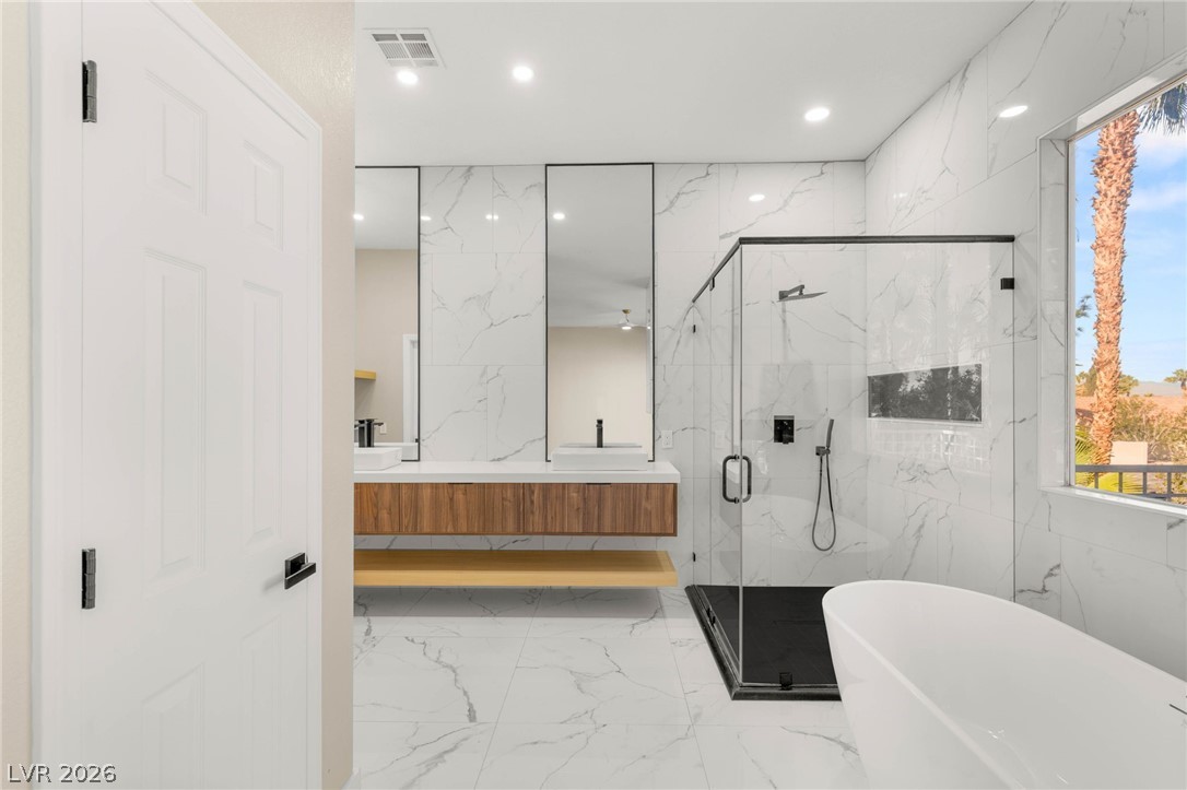 2104 Inverness Drive Henderson, NV 89074 - Photo 28 of 51 Bathroom featuring a marble finish shower, double vanity, a soaking tub, recessed lighting, and light marble finish floors