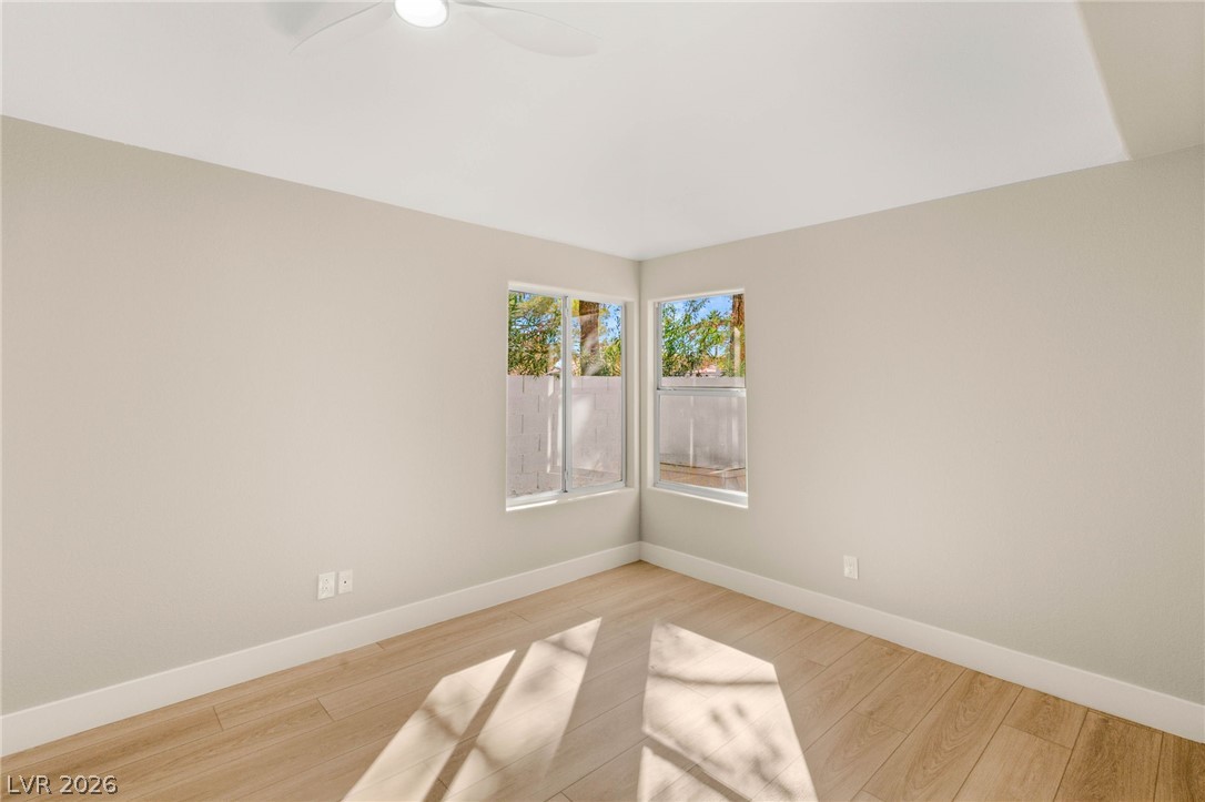 2104 Inverness Drive Henderson, NV 89074 - Photo 35 of 51 Unfurnished room with baseboards and light wood-type flooring