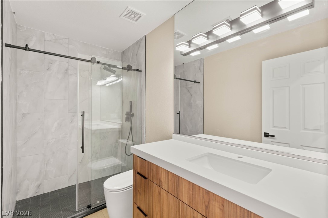 2104 Inverness Drive Henderson, NV 89074 - Photo 36 of 51 Full bath with a marble finish shower and vanity