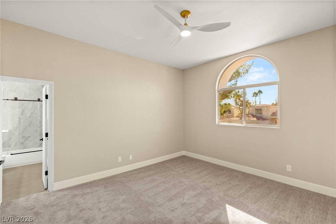2104 Inverness Drive Henderson, NV 89074 - Photo 37 of 51 Spare room featuring light carpet and a ceiling fan