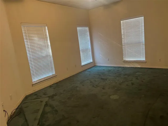 a view of a room that has a window in it