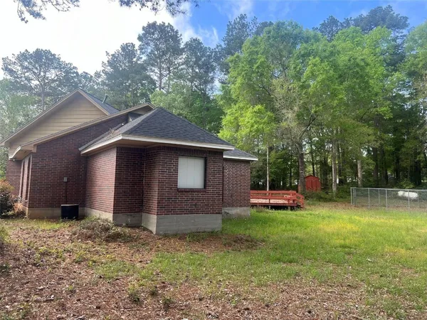 a backyard of a house with lots of green space