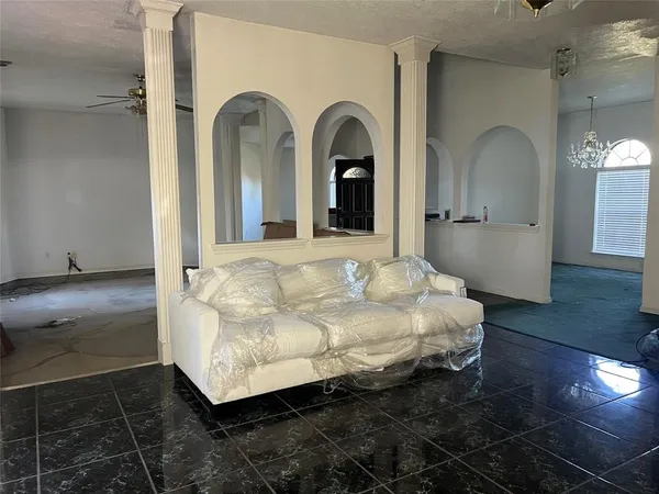 a living room with a couch and a rug