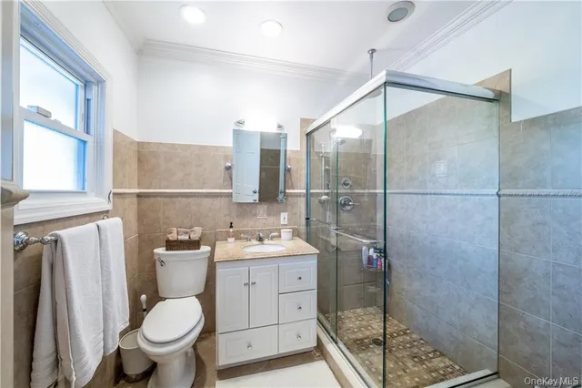 a bathroom with a toilet sink and a shower