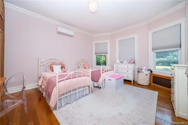 a bed room with two beds and a large window