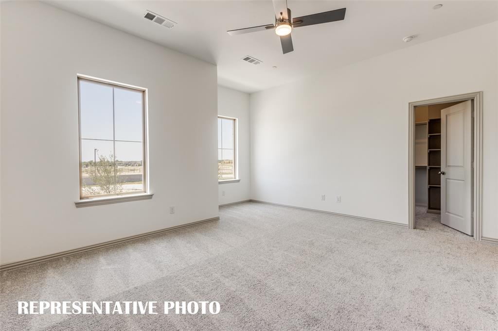 2844 Chisos Red Road McKinney, TX 75071 - Photo 7 of 13 Oversized windows, a large walk in closet and reading nook are just a few of the designer touches found in this fantastic owner's suite. REPRESENTATIVE PHOTO.