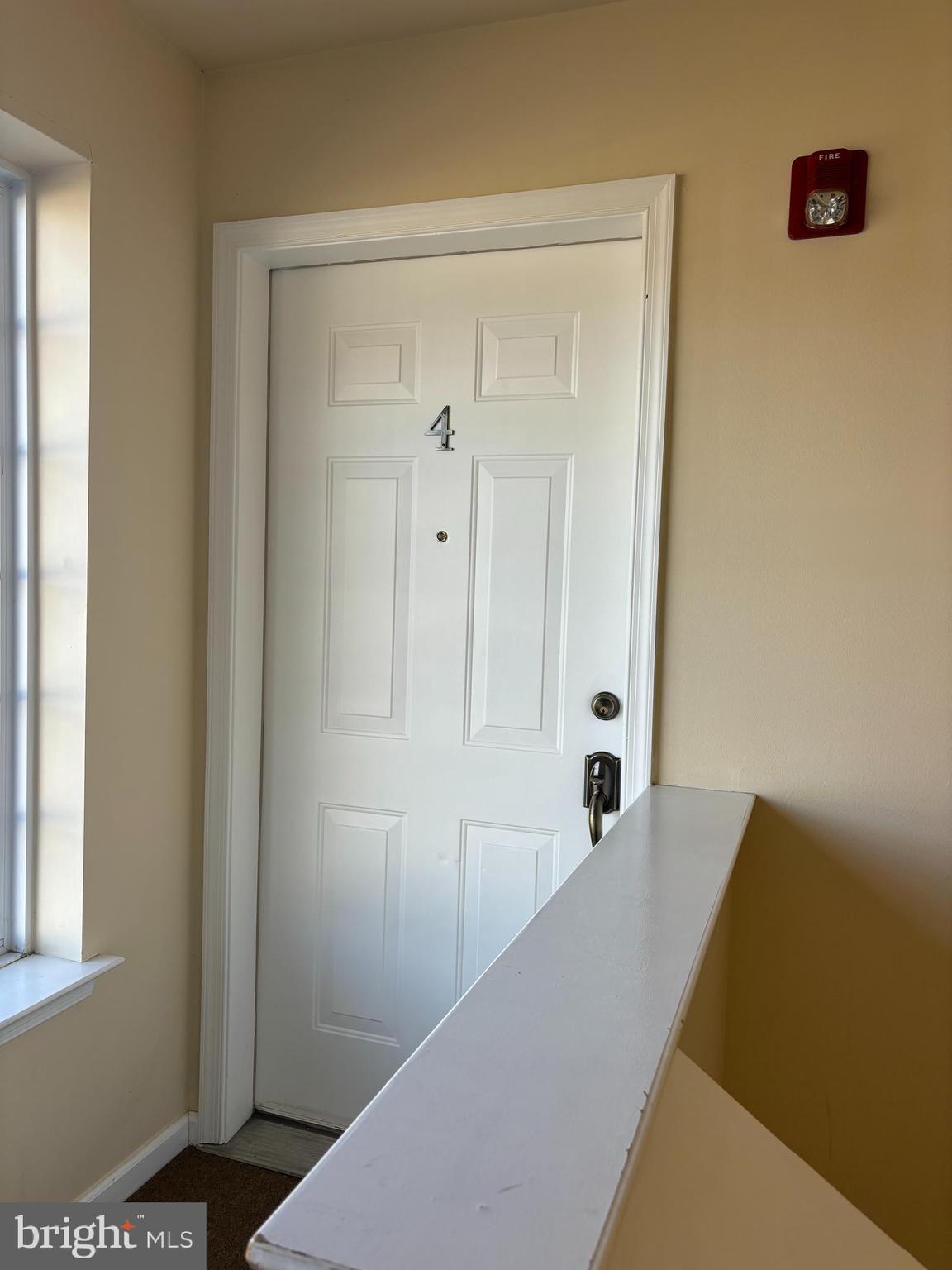 9228 Blue Grass Road, Unit 4 Philadelphia, PA 19114 - Photo 2 of 17 a view of a hallway with windows