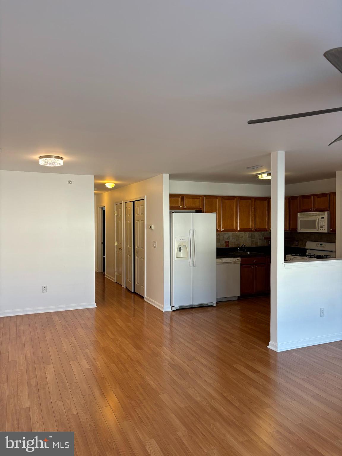 9228 Blue Grass Road, Unit 4 Philadelphia, PA 19114 - Photo 6 of 17 a view of a kitchen with wooden floor and a sink