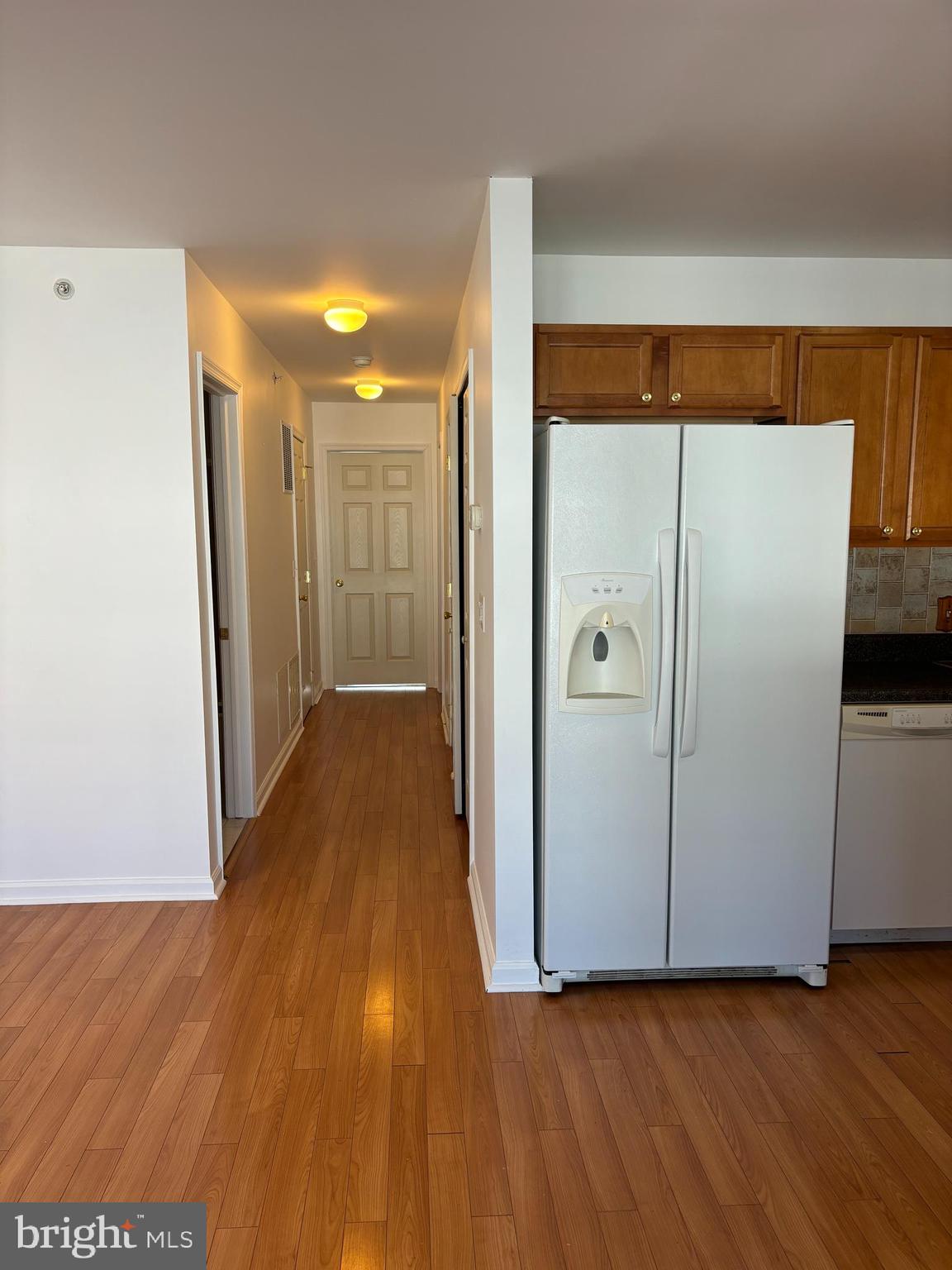 9228 Blue Grass Road, Unit 4 Philadelphia, PA 19114 - Photo 8 of 17 a view of a hallway with wooden floor