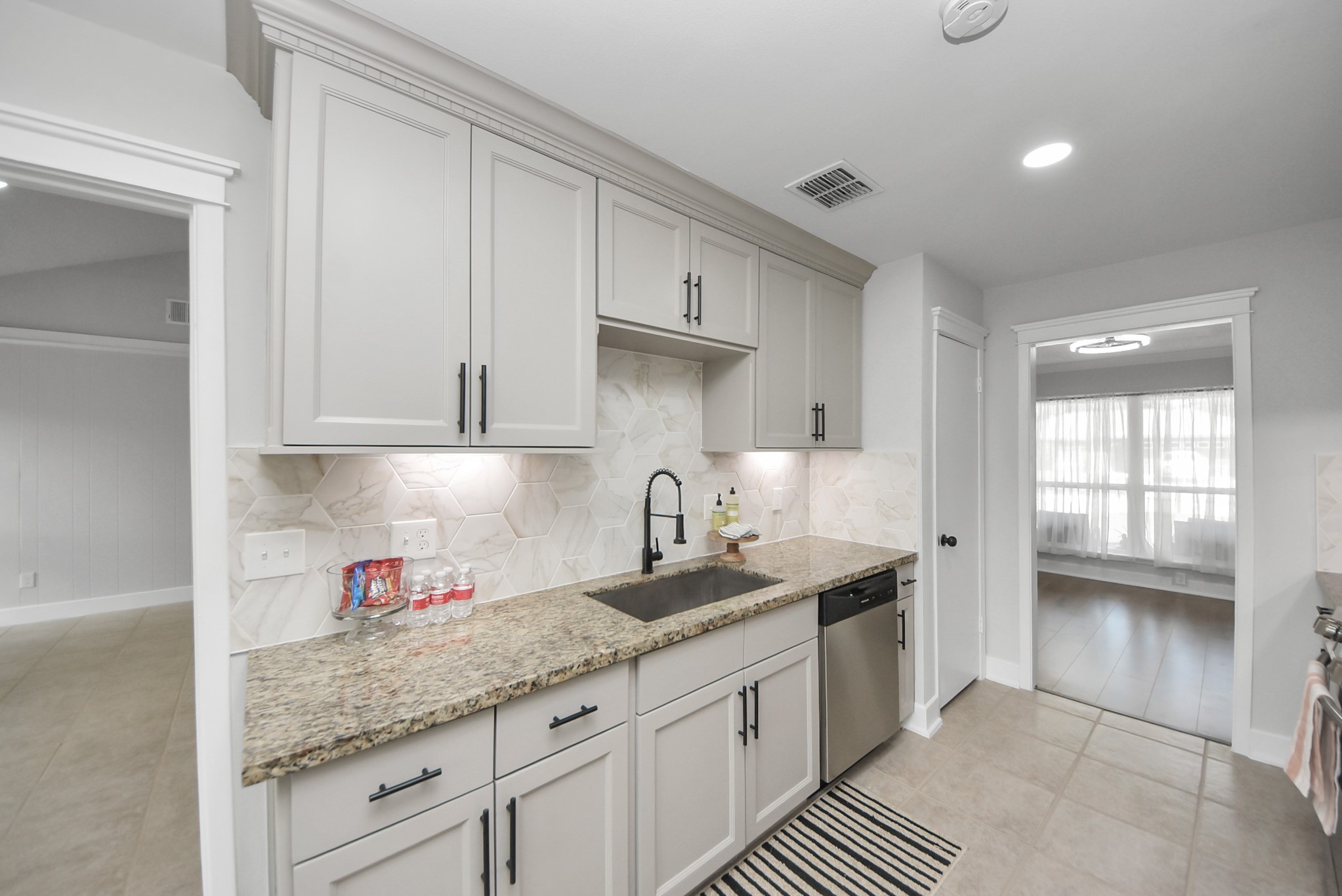5314 Sweetwind Lane Spring, TX 77373 - Photo 14 of 47 Modern appliances and under-cabinet lighting complement kitchen.